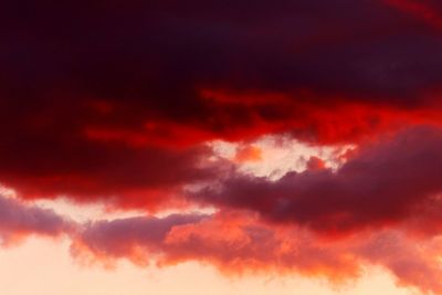 Low angle view of dramatic sky during sunset