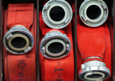 Full frame shot of rolled red fire hoses