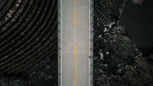 High angle view of tire tracks on road
