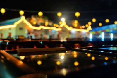 Defocused image of illuminated city at night