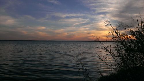 Scenic view of sea at sunset