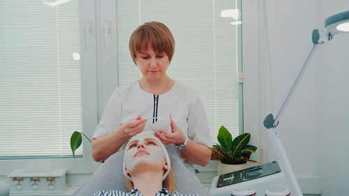 Woman getting beauty treatment at spa