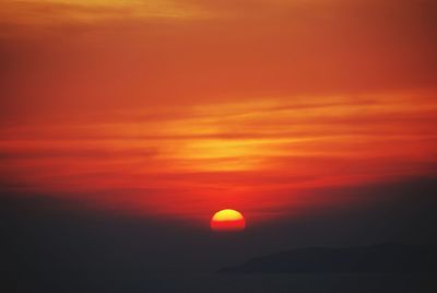 Scenic view of sea against orange sky