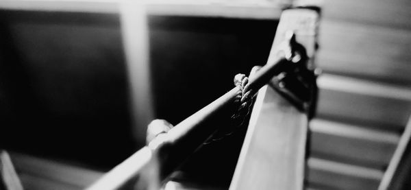 Close-up of woman hand on railing