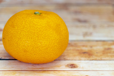 Close-up of orange fruit on table