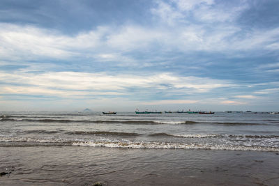 Beach vibes at morning near sea shore with many fishing boats
