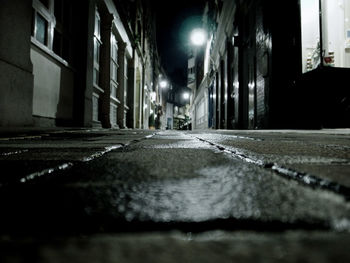Illuminated street lights in city at night