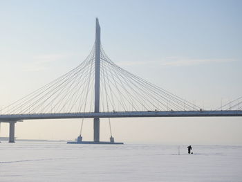 Suspension bridge against sky during winter