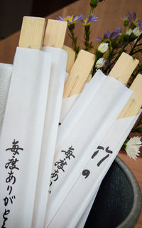 High angle view of chopsticks in paper