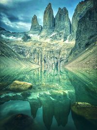 Scenic view of rocks in mountains against sky