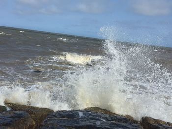 Waves splashing on rocks