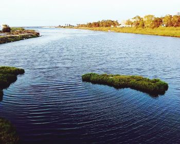 Scenic view of river against sky