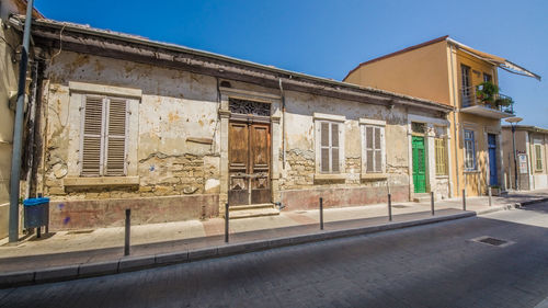 Exterior of old building against clear blue sky