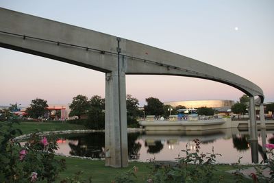 Bridge over river with buildings in background