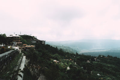 Scenic view of buildings in city against sky