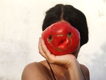 Close-up of woman holding red ice cream