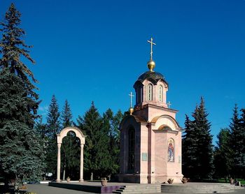 Low angle view of church against blue sky