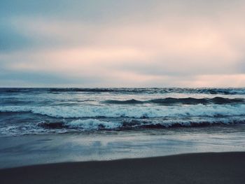 Scenic view of sea at sunset