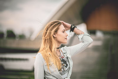 Portrait of young woman standing outdoors