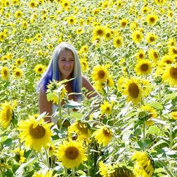 Portrait of smiling girl on sunflower field