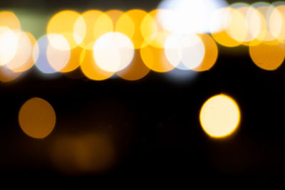 Defocused image of illuminated lights at night