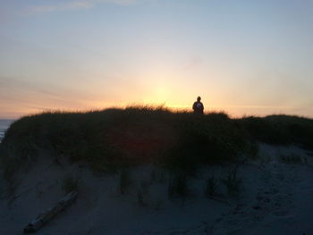 Scenic view of landscape at sunset