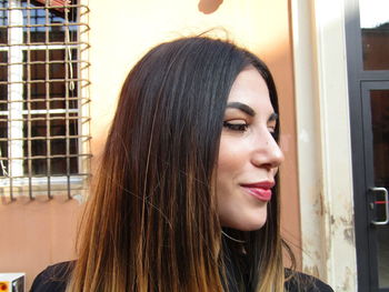 Portrait of a beautiful young woman looking away