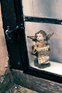 Close-up of old toys toy on wood