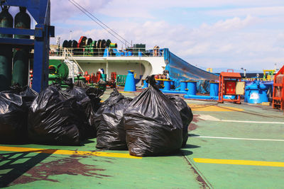 Garbage on road against cloudy sky