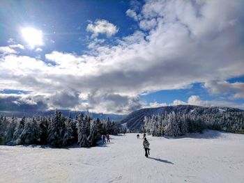 Scenic view of snow covered landscape against sky