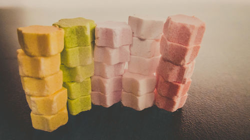 Close-up of multi colored candies on table