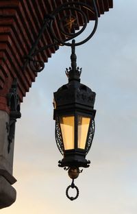 Low angle view of lantern against sky