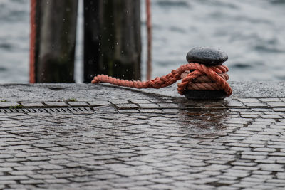 Close-up of rope tied to bollard