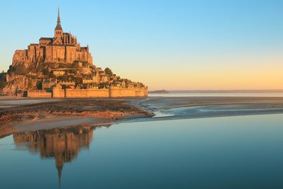 Morning light on mont saint michel in normandy, france 