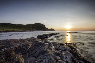 Scenic view of sea against sky during sunset