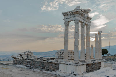 Old ruins of temple against cloudy sky