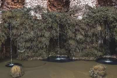 View of water flowing through rocks