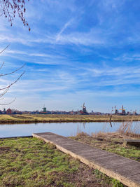 Scenic view of landscape against blue sky