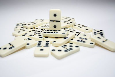 High angle view of piano keys on white background