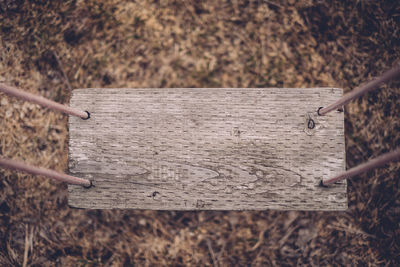 Close-up of hand on wood