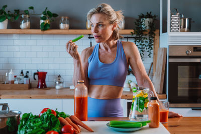Young woman applying in kitchen