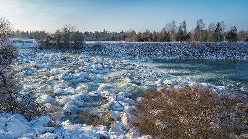 Scenic view of frozen lake against sky