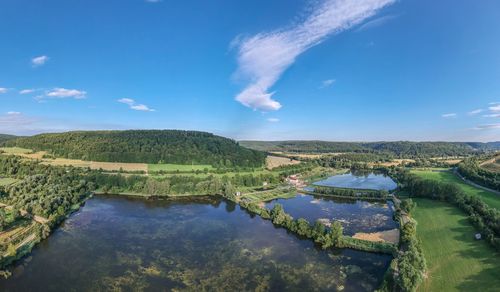 Panoramic view of landscape and lake against sky