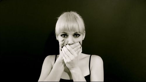 Close-up of hands over black background