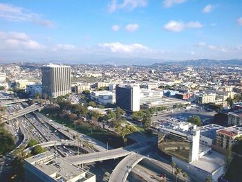 Cityscape against cloudy sky