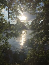 Scenic view of lake against sky during sunset