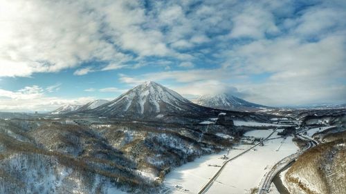 Scenic view of snowcapped mountains against sky