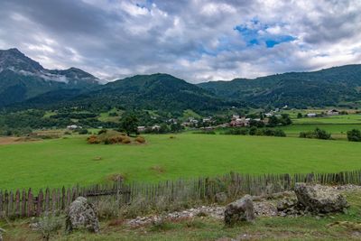 Scenic view of farm against sky