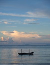 Boat in sea against sky during sunset at dili, timor leste.