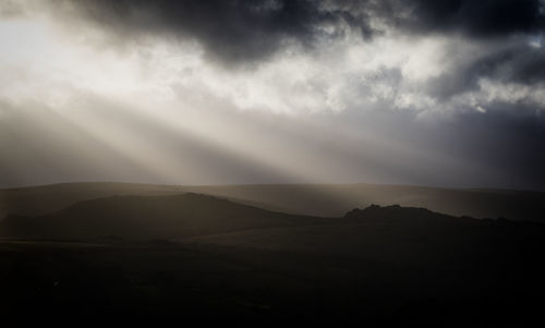 Scenic view of silhouette mountain against sky